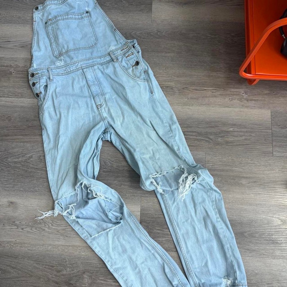 BDG light blue denim overalls with distressed details
